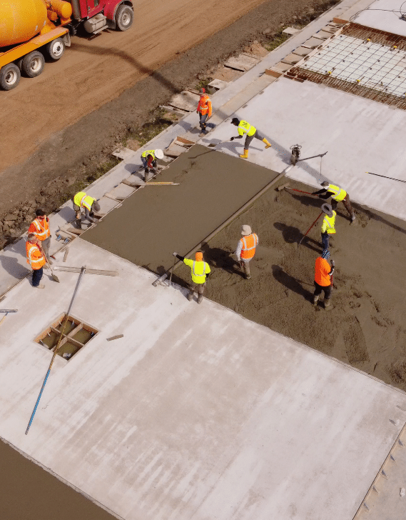 Valor crew placing and finishing a concrete slab