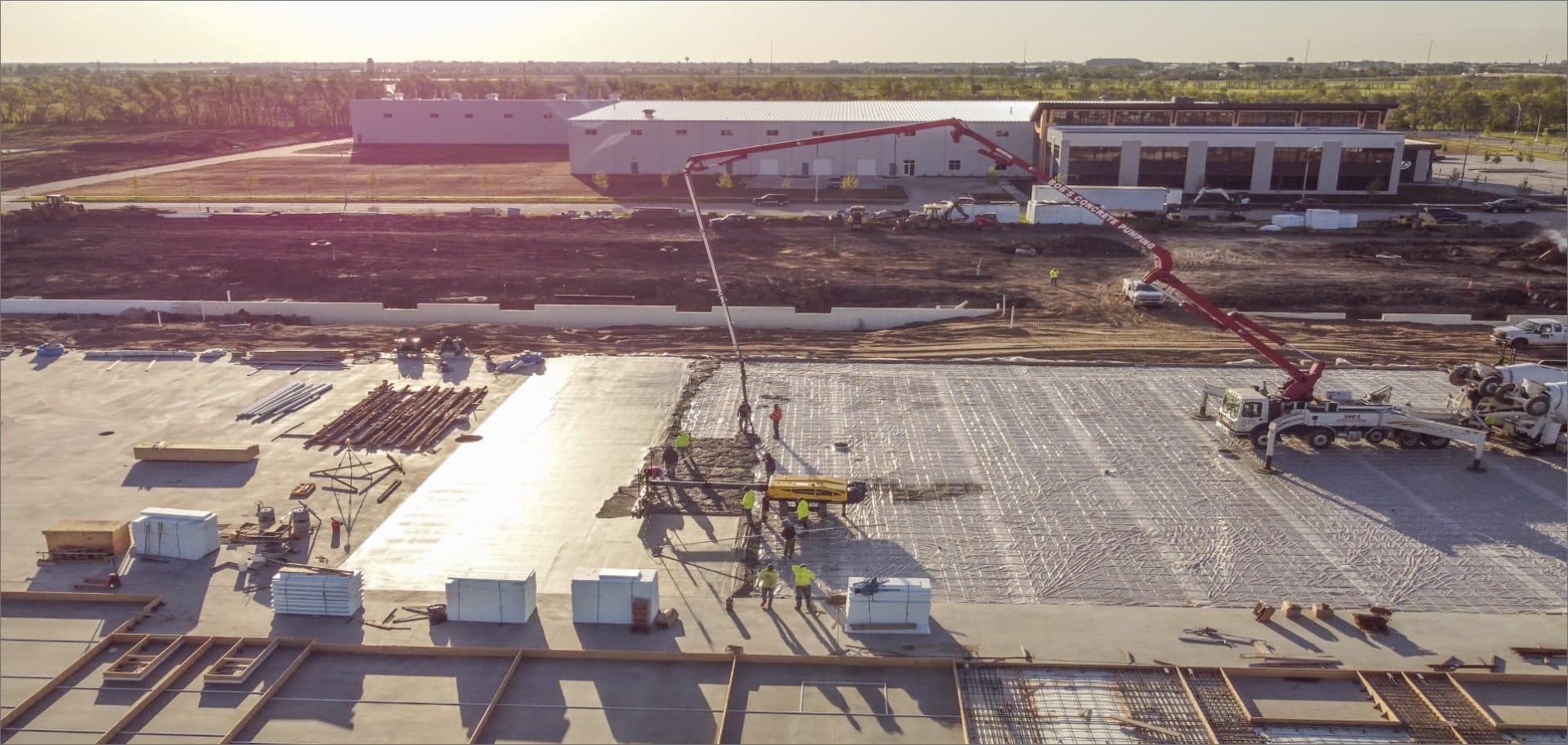 Aerial view of a Valor commercial construction site at sunset